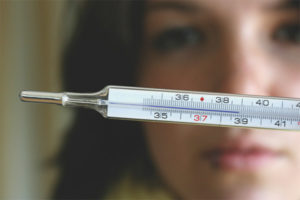 What temperature should be brought down in an adult